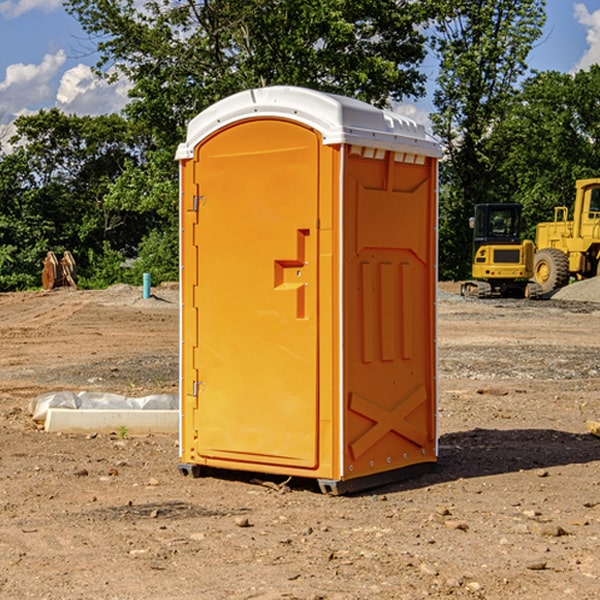 what is the cost difference between standard and deluxe portable restroom rentals in Shiner